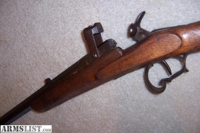 It looks a lot like some model of a Belgium Flobert rifle. 